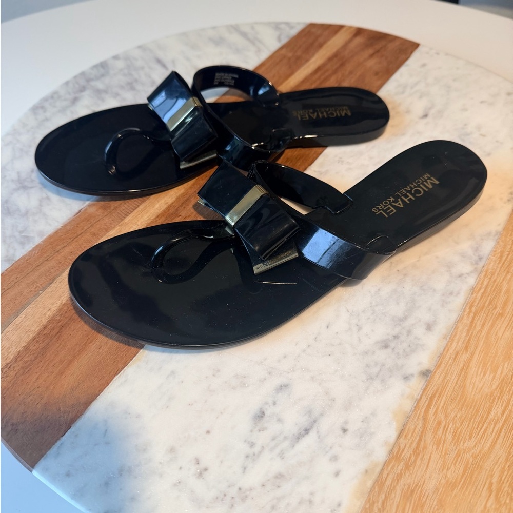 Michael Kors Glossy Black Sandals with Gold Bow